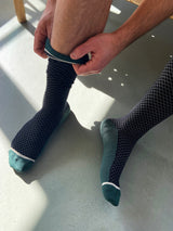 Wool compression stockings, black and green with white grid