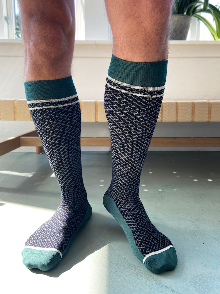 Wool compression stockings, black and green with white grid